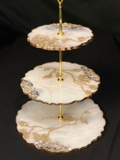 three tiered serving tray with gold accents