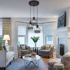 a living room filled with furniture and a fire place