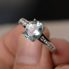 This is a gorgeous handmade creation. Its beauty is its simplicity & Elegance. The 7*9 mm oval shape faceted natural aquamarine is crafted in solid sterling silver and with rhodium plated. All item is sent in a beautiful gift box If you have any idea of design your ring,pls contact me directly. You can realize more lovely stuff clicking the link https://www.etsy.com/shop/knightjewelry?refshopsection_shophome_leftnav Please leave the correct address and you phone number for delivering success Oval Cut Wedding Ring, Cushion Cut Wedding Rings, Garnet Wedding Rings, Wedding Ring Cushion, Blue Aquamarine Ring, March Birthstone Ring, September Birthstone Rings, June Birthstone Ring, Blue Gemstone Rings