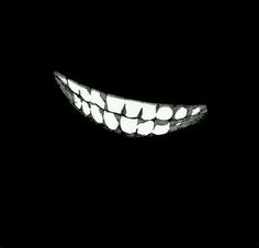 an image of a scary smile in the dark