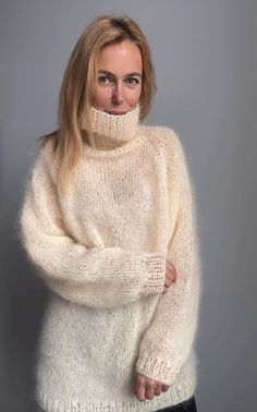 Mohair sweater Hand knit Length is 75 cm (29.5') Hand knitted mohair sweater is perfect for autumn and winter. This sweater with turtleneck is a warm and oversized fit. Yarn: High quality yarn 25% wool, 25% mohair, 50 % acrylic CARE: Hand wash in cold water then lay flat to dry. All items are beautifully wrapped. Ready to be a gift for your lovely person. You can order longer sweater or sleeves / or shorter - please contact me in the convo. Can be ordered in different size or color. Other sizes Slouchy Sweater For Winter Layering, Mohair Long Sleeve Sweater For Fall, Cozy Mohair Sweater For Fall, Winter Mohair Sweater With Soft Knit, One Size Cream Long Sleeve Sweater, Winter Mohair Turtleneck Sweater, Mohair Long Sleeve Chunky Knit Sweater, Mohair Chunky Knit Sweater For Fall, Hand Knitted Mohair Cream Sweater