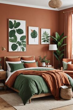 a bedroom with orange walls, green and white bedding and paintings on the wall