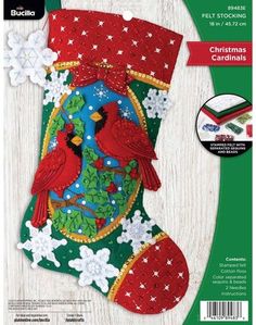 a christmas stocking with two red birds on it