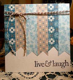 a blue and white greeting card with twine on the edge that says live & laugh