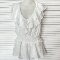 Dreamy Sleeveless Ruffled White Pullover Blouse By Do+Be. Nwot. Crisp White Polyester Gauze Fabric. Polyester Lining. No Stains, No Flaws. Excellent Condition! Elastic Waist. Size Xs. Machine Washable. Measurements: Pit To Pit 17” Elastic Waist Adjusts From 26-32” (Depending On Stretch) Hip 36” Back Length 26” Summer Tops With Flutter Sleeve And Ruffle Hem, Summer Blouse With Ruffles And Flutter Sleeves, Ruffled Straps Blouse With Ruffle Hem For Day Out, Sleeveless Summer Top With Ruffle Hem, White Sleeveless Top With Ruffle Hem, Sleeveless Ruffle Hem Top For Summer, Sleeveless Ruffle Hem Blouse For Summer, Day Out Blouse With Ruffled Straps, Summer Flutter Sleeve Top With Ruffles