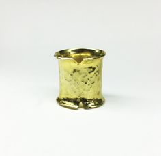 This is a handmade ring made from a bronze sheet then soldered and hammered and finally gold plated 24ct MATERIALS: gold plated bronze DIMENSION:2 cm height(0,8 inch approximately) I can make this ring to your size.You can find your size by looking here:http://www.bluenile.com/pdf/bluenile_ringsizer_copyright2008.pdf Every ring is handmade and unique. You will receive a very similar to the photo but not identical. I will pack your ring in a gift box as in my last photo.See my shop policies here: Architectural Rings, Big Statement Rings, Hammered Gold Ring, Gold Statement Ring, Bronze Ring, Contemporary Ring, Statement Ring Silver, Hammered Gold, Silver Bars