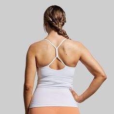 Breathability, functionality, adaptability—The Drop Shot Tank was designed to hit every mark. With a stretchy fabric that doesn’t restrict your range of motion and an ultra-flattering fit, this tank will have you hitting the perfect drop shot in next-level style. White 4-way Stretch Activewear For Sports, White Moisture-wicking Sports Bra With 4-way Stretch, White 4-way Stretch Sports Bra With Moisture-wicking, Versatile Compressive Tank Top For Sports, Versatile White Breathable Activewear, Compressive Sports Tank Top With Light Support, White Go-dry Functional Activewear, White 4-way Stretch Activewear For Workout, Versatile Sports Activewear With Tank Straps