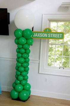 a balloon column with a street sign on it