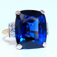 Gia Certified: 20.25ct. Lab Created Sapphire Ring. Full Cut Brilliant Cushion Cut Clean Clarity Transparent And Vibrant Top Bright Gem Royal Blue 16.10 X 13.46 X 9.38mm Lab Grown. .37ct. Natural Diamonds Rounds, Full Cut G-Color Vs-2 Clarity 14kt. Yellow Gold 7.9 Grams Ring Depth 9.5mm Current Ring Size: 6.5 May Resize, Please Inquire $6000 Appraisal Will Accompany Luxury Royal Blue Sapphire Ring, Luxury Royal Blue Rings For Formal Occasions, Luxury Royal Blue Formal Rings, Luxury Blue Sapphire Ring For Formal Occasions, Blue Diamond Ring For Evening, Exquisite Blue Sapphire Ring For Formal Occasions, Luxury Blue Rings For Evening, Blue Gemstone Rings For Evening, Luxury Blue Rings For Party