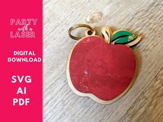 an apple shaped keychain with the words party with a laser printed on it