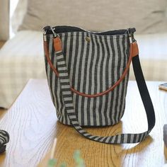 Comfortable, One of Kind. Shoulder Bags online shop,|Street|Shoulder Bag|Cotton Linen|Button|Cellphone pocket|Striped|Female|Gray|Small Bags To Make, Shop Street, Bags Online Shopping, Pocket Pattern, Linen Bag, Vertical Stripes, Knitted Bags, Online Bags, Beautiful Bags