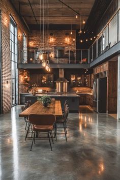 an industrial style kitchen and dining room are featured in this image