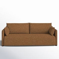 a brown couch sitting on top of a white floor