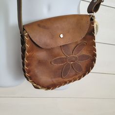 Vintage Authentic Mexican Brown Leather Hand Bag. Adjustable Strap For Cross Body Or Shoulder Strap. No Holes Or Tears In Leather. Marks Amd Scratches Are Ingrained In The Leather, Giving This Bag Character. The Crafted Flower Design Sewn Into Front Is Dainty And Beautiful. Handmade Leather Casual Bag, Casual Handmade Leather Bag, Handmade Leather Casual Shoulder Bag, Brown Hand-stitched Crossbody Bag, Leather Hand-stitched Shoulder Bag, Leather Bags Handmade Women, Tory Burch Camera Bag, Leather Purse Pattern, Thrift List