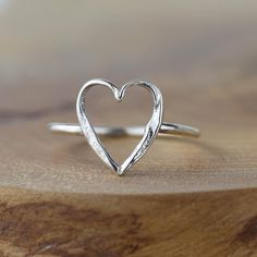 This sweet small heart ring sterling silver heart ring makes a wonderful gift for a really good friend, or for the one you love. Our signature Storybook texture features heavily on this heart ring design, making it perfect to mix and match with other pieces from the Storybook and Happily Ever After collections. Each piece is handmade in our small workshop in the village of Dounby on the Orkney Islands, a little island just off the top of Scotland.Items are posted in an unmarked box. Each piece i Heart Ring Design, Open Heart Ring, Silver Heart Ring, Tarnished Jewelry, Horses Pendant, Textured Ring, Rings Cool, Open Heart, Small Heart