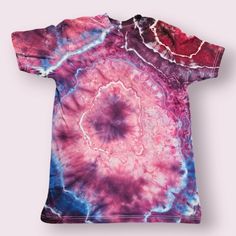 This comfy short-sleeved men's or unisex medium t-shirt has been hand-dyed in a retro geode pattern. The purple and pink colors give it a relaxed, bohemian vibe perfect for casual outings or lounging at home. My dyeing process ensures that each shirt is one-of-a-kind, with unique patterns and variations that add to its charm. Made from soft cotton, it's not only stylish but also comfortable for all-day wear. This stafford brand t-shirt is ideal for those who appreciate a laid-back yet distinctive look that stands out with its artisanal touch. This shirt makes the perfect gift for the free spirit in your life!  0829 Tie Dye Short Sleeve Shirt For Summer, Short Sleeve Tie Dye Shirt For Summer, Hand Dyed Short Sleeve Tops For Summer, Purple Relaxed Fit Graphic Tee, Tie-dye Pre-shrunk Short Sleeve T-shirt, Tie Dye Short Sleeve T-shirt, Pre-shrunk Tie Dye Short Sleeve T-shirt, Pre-shrunk Tie-dye Short Sleeve T-shirt, Unisex Tie Dye Short Sleeve T-shirt