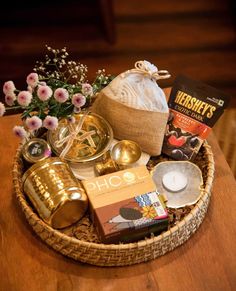 a basket filled with items sitting on top of a wooden table