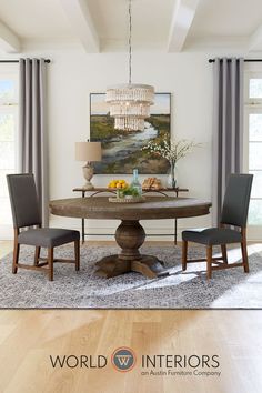 a dining room table with chairs and a chandelier hanging from the ceiling above it