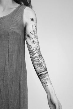 a woman with a tattoo on her arm