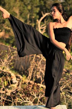 Long flowy Persephone Palazzo Pants come in one size, fits sizes 0-14. Soft stretchy viscose waist band can be worn high or folded over. Pull string around hips created snug fit for smaller body sizes. Available in Onyx, Sage and Rust. Ethically handmade of tree pulp eco Lyocell fabric its silky, luxurious and stunning, also known as vegan silk. Matching Bell Sleeve Lily Tops, Halter Tops, and Tube Tops make gorgeous eco outfits. Mix and match styles and colors. Stretch Wide-leg Harem Pants For Loungewear, Stretch Harem Pants For Festivals, Bohemian Black Pants, Stretch Harem Bottoms For Festival, Black Wide Leg Summer Leggings, Flowy Festival Bottoms With Elastic Waistband, Stretch Bohemian High-waisted Pants, Flowy Bottoms With Elastic Waistband For Festivals, Stretch Harem Yoga Pants For Summer