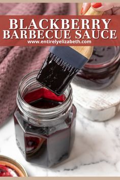 a jar filled with black berry barbecue sauce