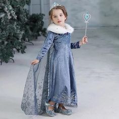 About this item 🌬️ Snowflake Print Tulle Cape: The enchantment doesn't stop with the dress – an attached snowflake print tulle cape adds a touch of whimsy, allowing your princess to twirl and spin in a flurry of snowflakes. 👑 Accessorize Like Royalty: The neck area is adorned with a soft plush accessory, an ice princess crown, and a staff, transforming your little one into the spitting image of Elsa. Gloves complete the look, making her feel like true royalty. 💖 Quality That Endures: Moda By Elsa Gloves, Elsa Frozen Costume, Cinderella Cosplay, Dress Up Clothes, Tulle Cape, Elsa Costume, Halloween Carnival Party, Frozen Costume, Spitting Image