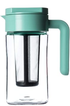 a glass coffee maker with a green handle