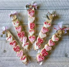 valentine's day treats are arranged on a wooden table