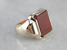 Simple and solid in size, this could be a great vintage piece! Dating to the mid-1900's, and the popular style continues to be a favorite decades later. The center of this ring is set with a deep, brick-red carnelian. Carnelian is traditionally a stone of courage, worn by leaders and heroes. Metal: 10K Yellow Gold Gem: Carnelian Gem Measurements: 11.3 x 14 mm, Rectangle Ring Size: 7.75 Marks: "HANDWROUGHT 10K" Stamped on the inside band Rectangle Ring, Retro Era, Red Carnelian, Wedding Rings Vintage, Men's Ring, Brick Red, Eternity Bands, Popular Style, Cookie Recipes