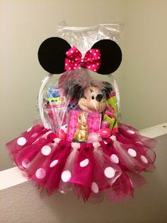 a minnie mouse doll in a pink tutu skirt