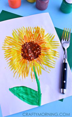 an art project for kids with watercolors and crayons on the table