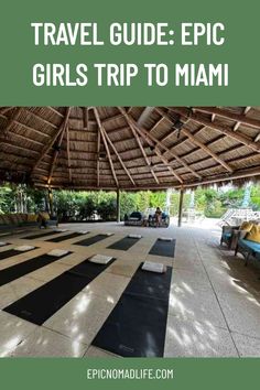 A zen outdoor space under a straw ceiling with yoga mats laid out for yoga class in Miami Beach Travel Journal Ideas