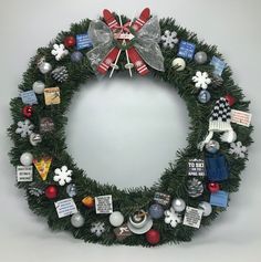 a christmas wreath with ornaments and decorations around it