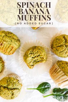 spinach and banana muffins in paper plates with basil leaves on the side