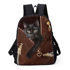 a black cat sitting on top of a backpack with keys hanging from it's side