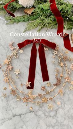 a christmas wreath with red velvet ribbon and gold stars