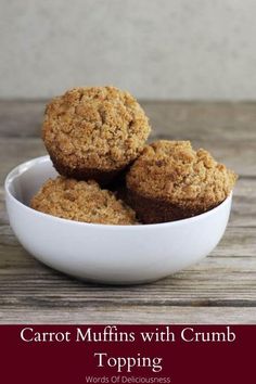 carrot muffins with crumb topping in a white bowl on a wooden table