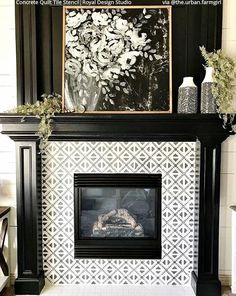 a black and white fireplace with flowers on the mantle