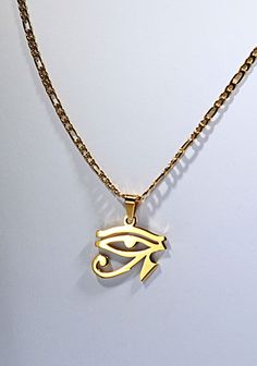 Shiny Gold Plated Eye of Horus  Charm Necklace  Lightweight Eye of Horus Jewelry ☆ Eye of Horus Necklace | Egyptian Jewelry  ☆ For Him or Her | Protection Amulet ☆ Strung with a quality gold bail onto ☆ A 60cm/ 23.6 inches long / 3mm wide     gold plated stainless steel FIGARO Chain     with lobster clasp. FOR A LARGER VERSION OF THIS  NECKLACE, GO HERE:  https://www.etsy.com/listing/1643074972/large-shiny-gold-eye-of-horus-pendant ☆ FREE Eco-Packaging in a Jewelry Gift Box & Gift Bag! ☆ Ships same day as order to USA. ☆ A FREE GIFT is included with every order! NO RETURNS OR EXCHANGES  ACCEPTED ON THIS ITEM. ☆ Be Powerfully GOLDEN this Season! Eye Of Horus Jewelry, Horus Jewelry, Gold Jewelry For Men, Streetwear Jewelry