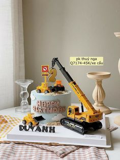 a birthday cake with construction vehicles on top