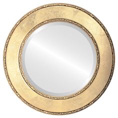 a round mirror with gold trim around it