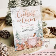 an advertisement for cookies and cocoa is displayed on a table with pine cones, snowflakes and other decorations