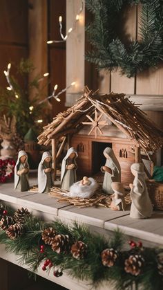 christmas scene with nativity scene and pine cones on mantel shelf in living room