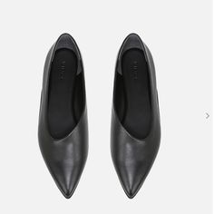 A Modern Approach To The Ballet Slipper, Our Supple Leather Flat Features An Assymetrical Shape And Pointed Toe. Slips On. Pointed Toe. Professional Clean Only. 100% Leather. Imported. Fit Heel Measures 0.5". Black Pointed Toe Flats For Office, Black Pointed Toe Flats With Leather Sole For Office, Black Pointed Toe Flats For Fall, Black Pointed Toe Flats For Office In Fall, Black Leather Pointed Toe Flats, Medium Width, Black Leather Pointed Toe Flats With Low Heel, Black Pointed Toe Flats Medium Width, Black Pointed Toe Flats With Low Heel For Office, Black Pointed Toe Flats For Business