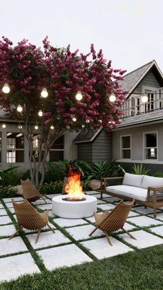 an outdoor fire pit surrounded by lawn furniture