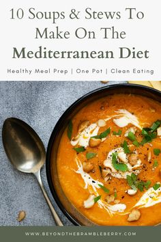 a bowl of soup with spoons on the side and text overlay reads 10 soups & stews to make on the mediterranean diet