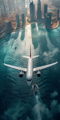 an airplane is flying over the water in front of some cityscapes and skyscrapers