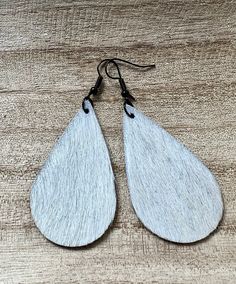 cowhide earrings, handmade jewelry, cowhide teardrop earrings, cowgirl style, hair on hide earrings, southwest earrings, gift for teen Each pair is 2 inches hand-cut from genuine cowhide  finished nickel free hardware.  Solid white ivory is perfect with multi patterns, handbags and other accessories. gifts for her , perfect ladies gift . goes with any cowhide duffel bag or purses. stocking stuffers or christmas gifts.   Handmade with genuine cowhide.  Take a look in my Etsy store for more sales Hide Earrings, Southwest Earrings, Cowhide Earrings, Christmas Gifts Handmade, Bar Styling, Multi Pattern, Style Hair, Bar Earrings