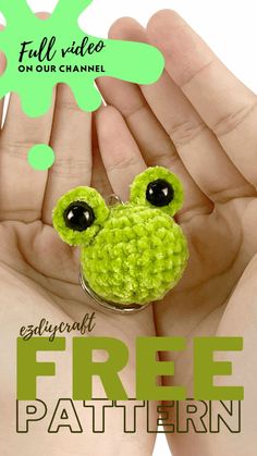 two hands holding a green frog keychain with the words free pattern below it