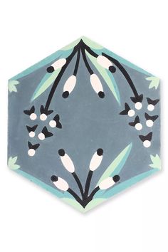 a blue and white tile with flowers on it's sides, in the shape of a hexagonal pentagon